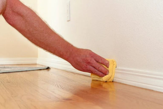 Spring cleaning dusting baseboards